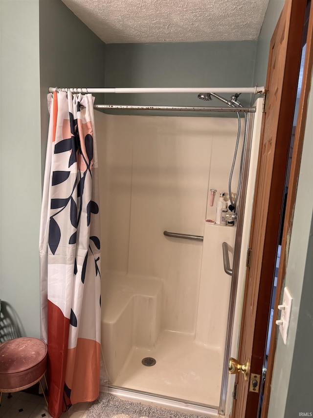 311 Hampshire Dr, Logansport, IN 46947 - full bathroom with a shower stall and a textured ceiling