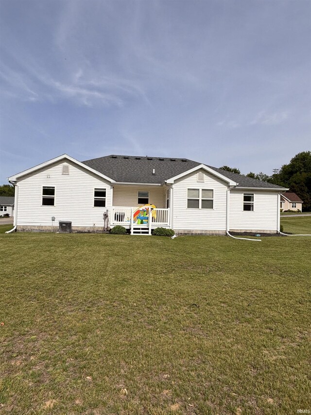 311 Hampshire Dr, Logansport, IN 46947 - back of house featuring a yard