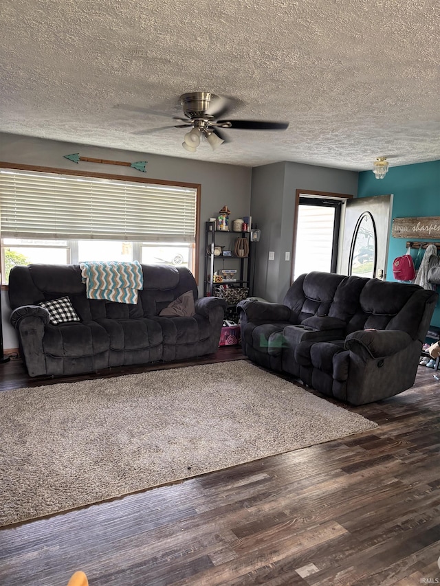 311 Hampshire Dr, Logansport, IN 46947 - living area with a textured ceiling, wood finished floors, and ceiling fan