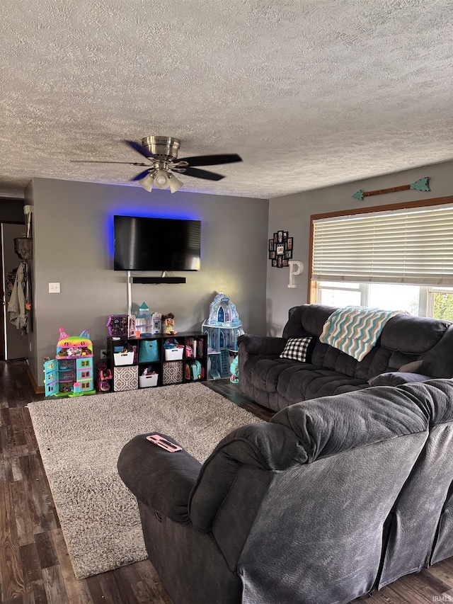 311 Hampshire Dr, Logansport, IN 46947 - living area featuring a textured ceiling, ceiling fan, and dark wood-type flooring
