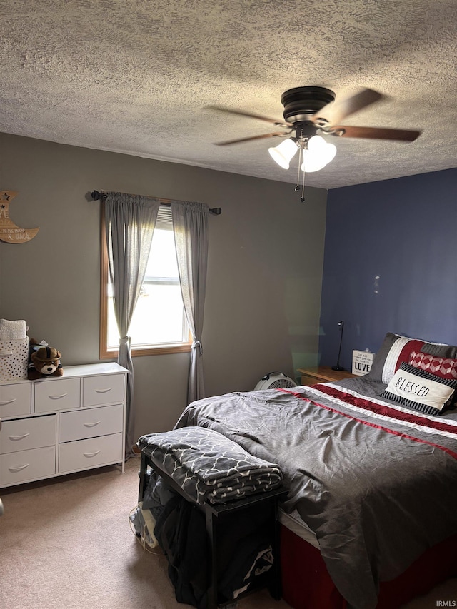 311 Hampshire Dr, Logansport, IN 46947 - bedroom with carpet, a textured ceiling, and ceiling fan
