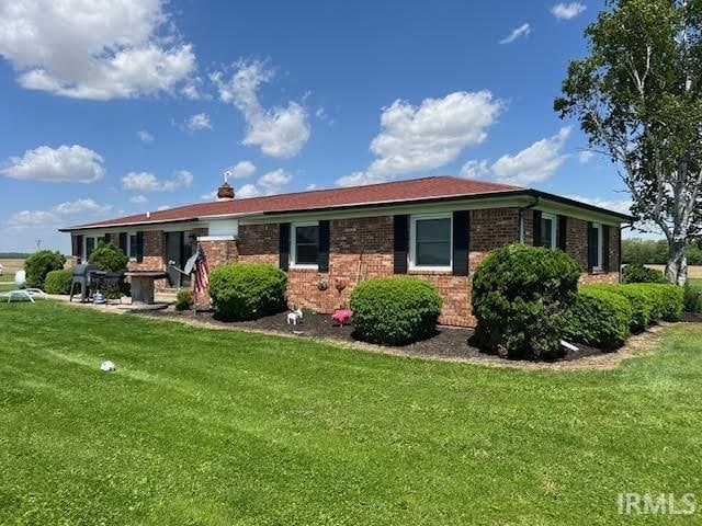 7109 W 100 S, Wabash, IN 46992 - view of front of property with a front yard and brick siding