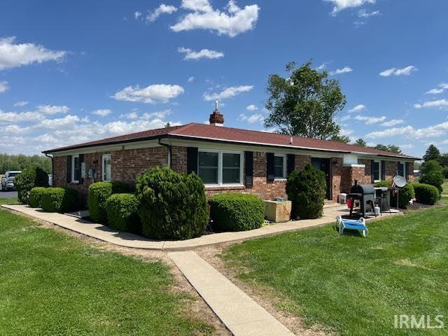 7109 W 100 S, Wabash, IN 46992 - single story home with brick siding and a front yard