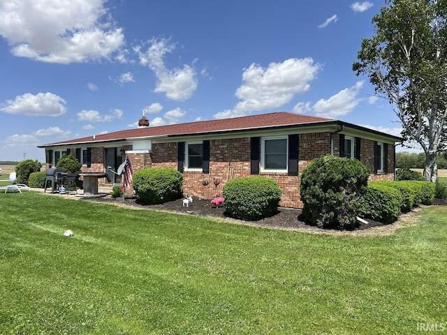 7109 W 100 S, Wabash, IN 46992 - ranch-style home with a front yard and brick siding
