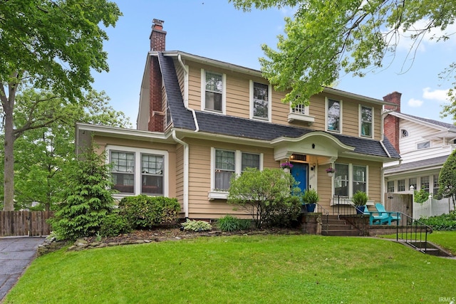 2215 Kensington Blvd, Fort Wayne, IN 46805 - view of front of property featuring a chimney and a shingled roof