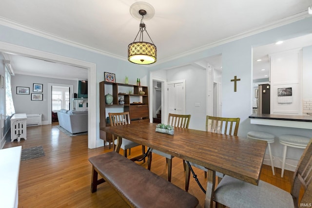 2215 Kensington Blvd, Fort Wayne, IN 46805 - dining room with crown molding, wood finished floors, stairs, and baseboards