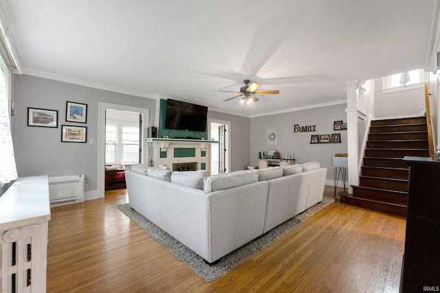 2215 Kensington Blvd, Fort Wayne, IN 46805 - living area featuring ceiling fan, stairs, light wood-type flooring, crown molding, and baseboards