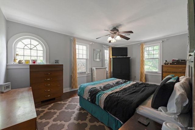 2215 Kensington Blvd, Fort Wayne, IN 46805 - bedroom featuring wood finished floors, radiator heating unit, baseboards, and ceiling fan