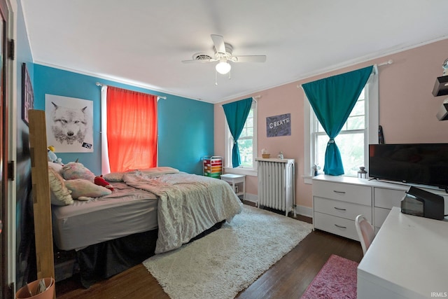 2215 Kensington Blvd, Fort Wayne, IN 46805 - bedroom featuring radiator, dark wood-style flooring, ceiling fan, and an office area