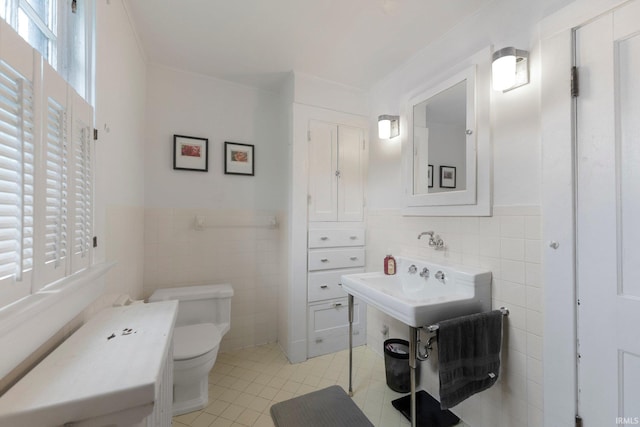 2215 Kensington Blvd, Fort Wayne, IN 46805 - bathroom featuring tile walls, toilet, tile patterned flooring, wainscoting, and crown molding