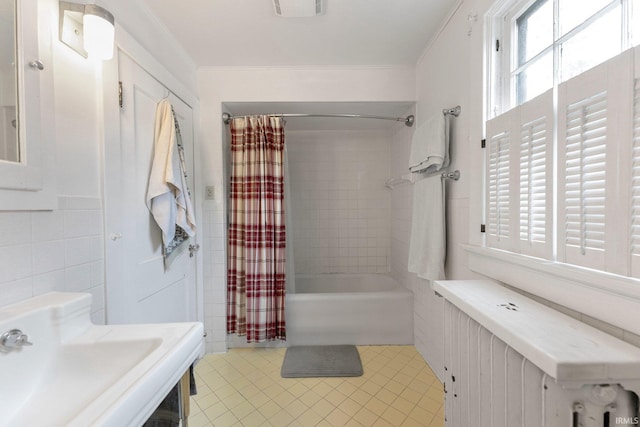 2215 Kensington Blvd, Fort Wayne, IN 46805 - full bathroom featuring radiator, tile patterned floors, shower / bathtub combination with curtain, ornamental molding, and tile walls