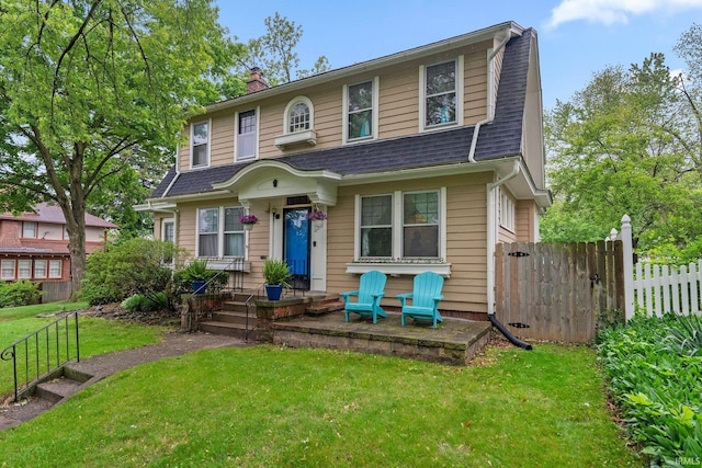 2215 Kensington Blvd, Fort Wayne, IN 46805 - view of front of house with a chimney and roof with shingles