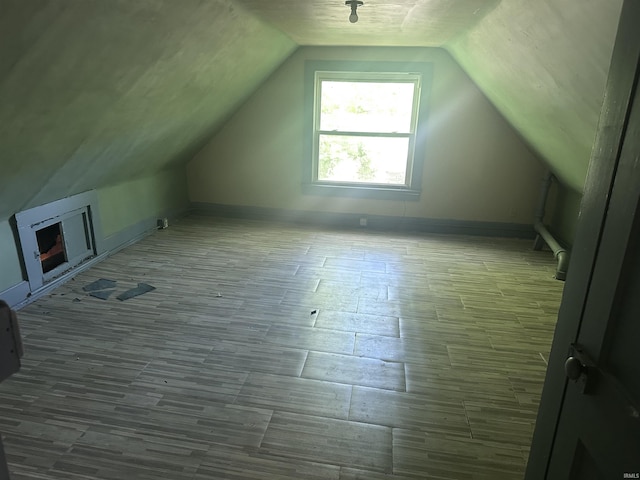 909 W Maryland St, Evansville, IN 47710 - bonus room featuring lofted ceiling, wood finished floors, and baseboards