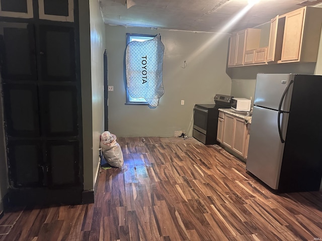 909 W Maryland St, Evansville, IN 47710 - kitchen with appliances with stainless steel finishes and dark wood-type flooring