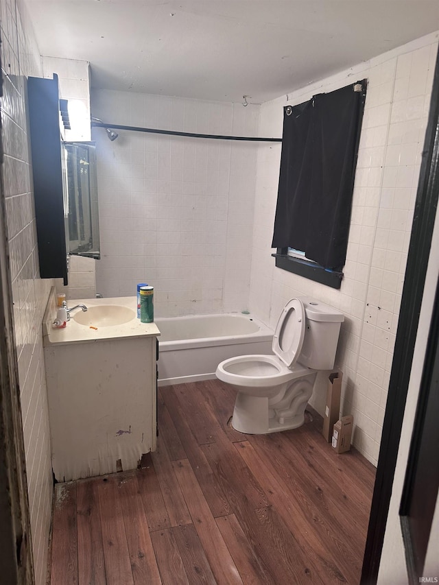 909 W Maryland St, Evansville, IN 47710 - bathroom with wood-type flooring, toilet, vanity, and shower / bath combination