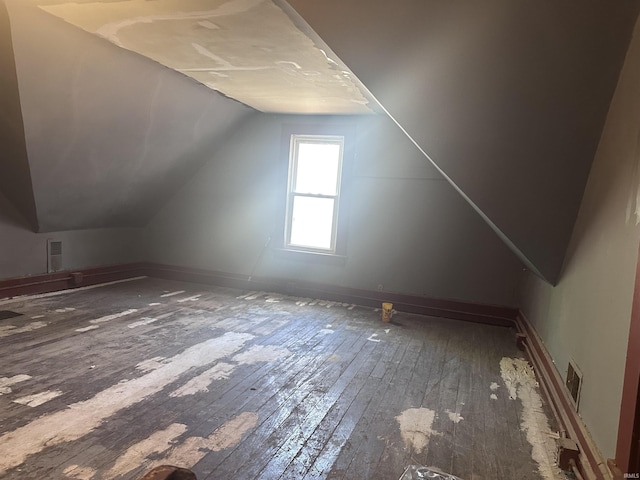 909 W Maryland St, Evansville, IN 47710 - bonus room featuring hardwood / wood-style flooring and lofted ceiling