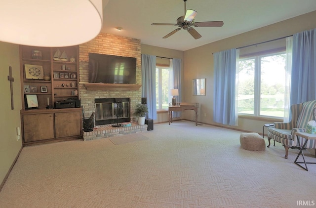 6322 Eagle Nest Ct, Fort Wayne, IN 46814 - carpeted living area featuring ceiling fan, plenty of natural light, a brick fireplace, and baseboards
