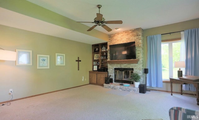 6322 Eagle Nest Ct, Fort Wayne, IN 46814 - carpeted living room featuring a brick fireplace, baseboards, ceiling fan, and built in shelves
