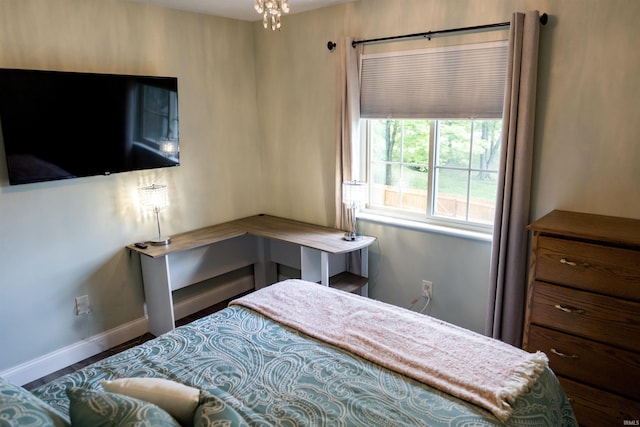 3850 W Woodmere Ct, Bloomington, IN 47403 - bedroom featuring baseboards and wood finished floors