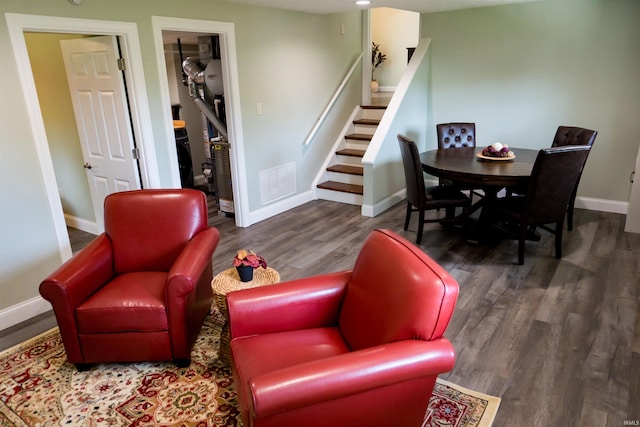 3850 W Woodmere Ct, Bloomington, IN 47403 - living area featuring stairs, wood finished floors, and baseboards
