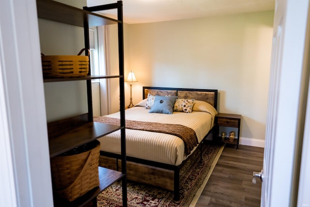 3850 W Woodmere Ct, Bloomington, IN 47403 - bedroom featuring wood finished floors and baseboards