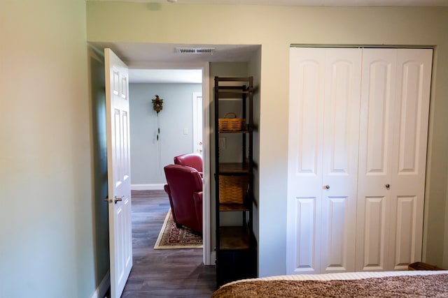 3850 W Woodmere Ct, Bloomington, IN 47403 - bedroom featuring a closet, dark wood-type flooring, and baseboards