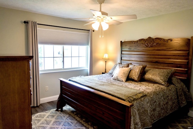 3850 W Woodmere Ct, Bloomington, IN 47403 - bedroom featuring wood finished floors, baseboards, and a ceiling fan