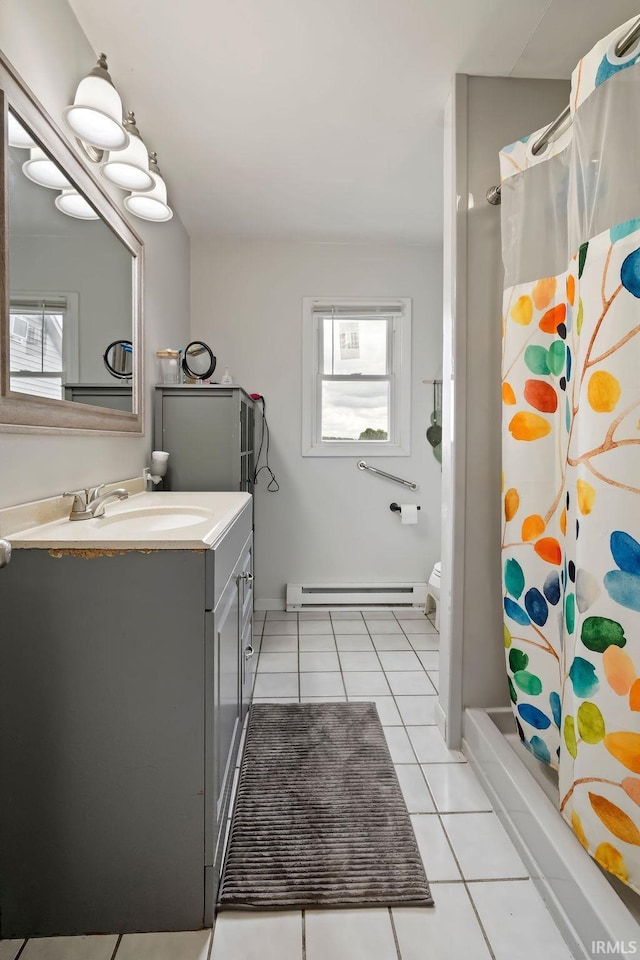 6659 W 400 S, Swayzee, IN 46986 - bathroom with baseboard heating, vanity, tile patterned flooring, toilet, and baseboards