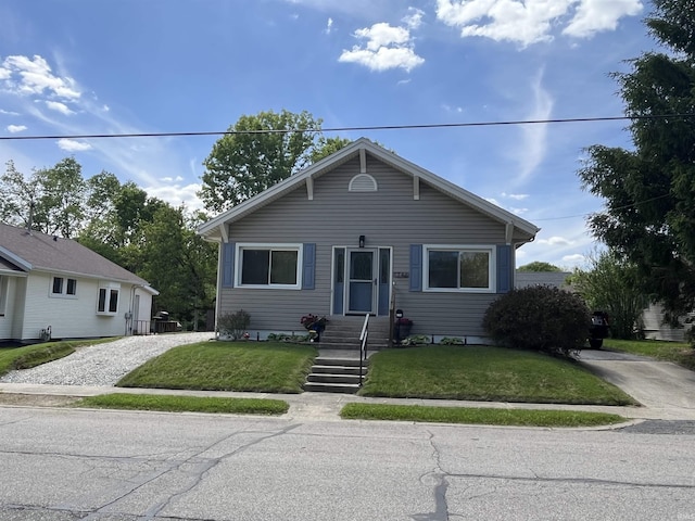 1746 College Ave, Huntington, IN 46750 - bungalow-style home featuring a front yard and driveway