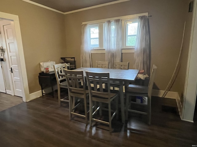 1746 College Ave, Huntington, IN 46750 - dining space with crown molding, dark wood-type flooring, and baseboards
