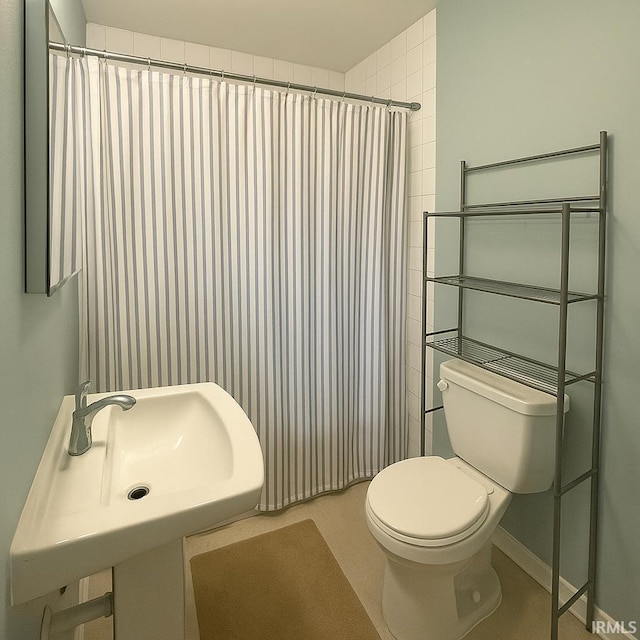 204 Dehart St, West Lafayette, IN 47906 - bathroom featuring toilet, curtained shower, and a sink