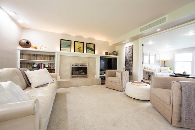 634 E Wildwood Dr, Warsaw, IN 46580 - carpeted living area featuring a high end fireplace and recessed lighting