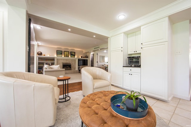 634 E Wildwood Dr, Warsaw, IN 46580 - living area featuring light tile patterned floors, recessed lighting, and a fireplace