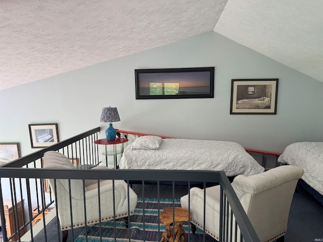9384 S Lake Ridge Dr Unit 90, Bloomington, IN 47401 - bedroom with a textured ceiling and lofted ceiling