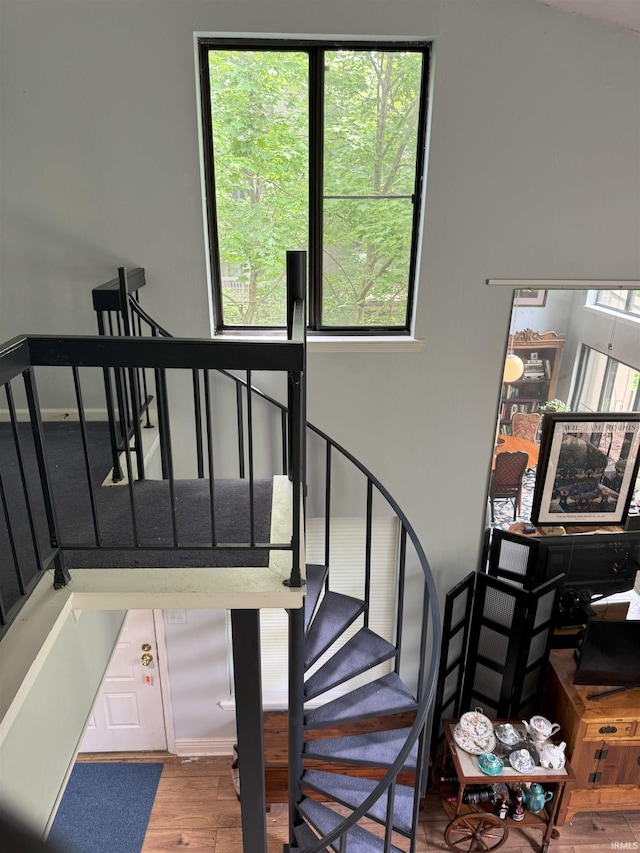 9384 S Lake Ridge Dr Unit 90, Bloomington, IN 47401 - stairway with plenty of natural light and wood finished floors