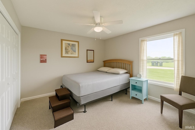 2014 N Macy Ln, Greensburg, IN 47240 - bedroom with light colored carpet, a closet, baseboards, and a ceiling fan