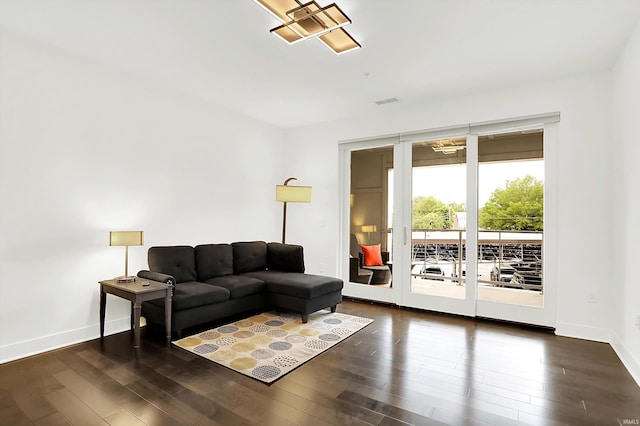 304 W Kirkwood Ave Unit 203, Bloomington, IN 47404 - living room with dark wood-style floors and baseboards