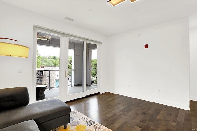304 W Kirkwood Ave Unit 203, Bloomington, IN 47404 - living room featuring dark wood-type flooring and baseboards