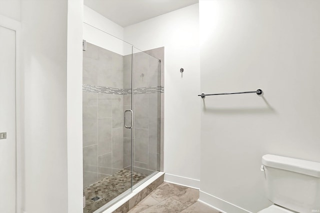 304 W Kirkwood Ave Unit 203, Bloomington, IN 47404 - full bath with baseboards, a shower stall, toilet, and marble finish floors