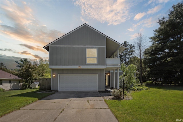 16828 Barryknoll Way, Granger, IN 46530 - view of front of home with an attached garage, driveway, a yard, and a balcony