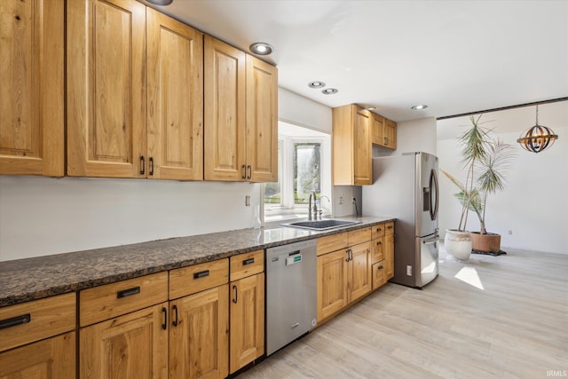 16828 Barryknoll Way, Granger, IN 46530 - kitchen featuring appliances with stainless steel finishes, a sink, light wood finished floors, and recessed lighting