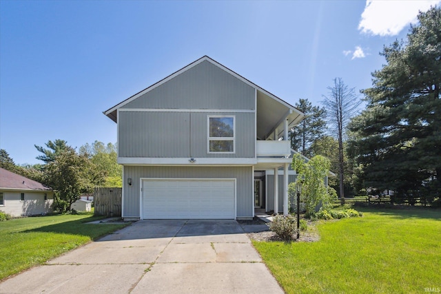 16828 Barryknoll Way, Granger, IN 46530 - view of front facade with a garage, concrete driveway, a front yard, and a balcony