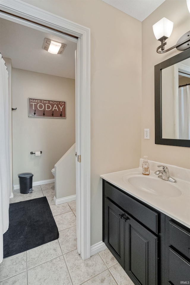 2006 Capital Hill Ct, Kokomo, IN 46902 - bathroom featuring vanity, tile patterned floors, toilet, and baseboards