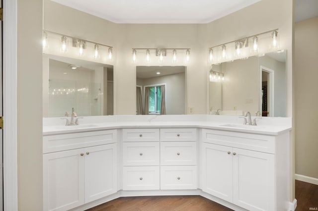 7301 W River Rd, Yorktown, IN 47396 - bathroom with double vanity, an enclosed shower, and wood finished floors