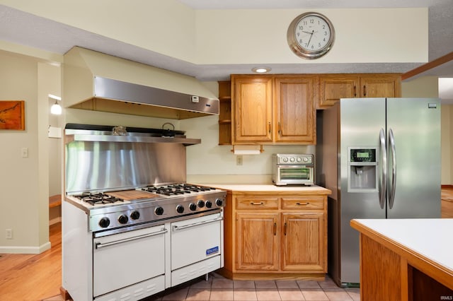 7301 W River Rd, Yorktown, IN 47396 - kitchen featuring stainless steel fridge with ice dispenser, double oven range, light countertops, ventilation hood, and open shelves
