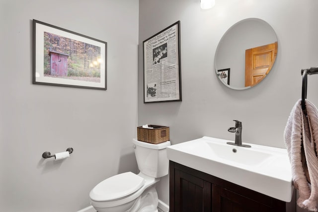 7301 W River Rd, Yorktown, IN 47396 - half bath with toilet, vanity, and baseboards