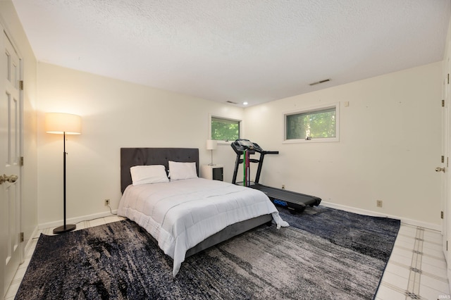 7301 W River Rd, Yorktown, IN 47396 - bedroom with a textured ceiling and baseboards