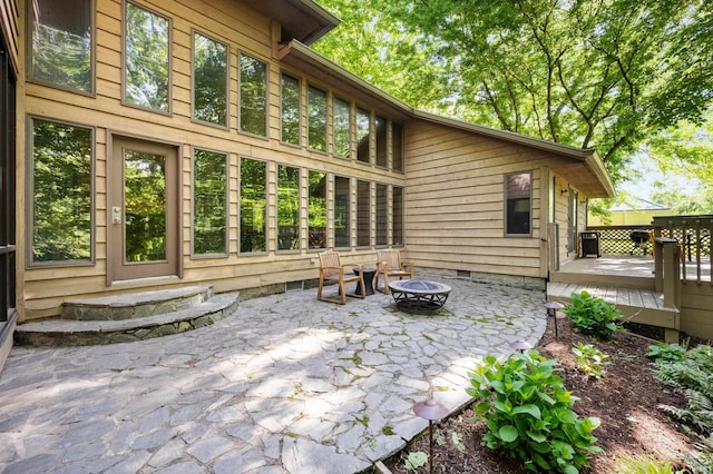 7301 W River Rd, Yorktown, IN 47396 - view of patio / terrace featuring a fire pit and a deck