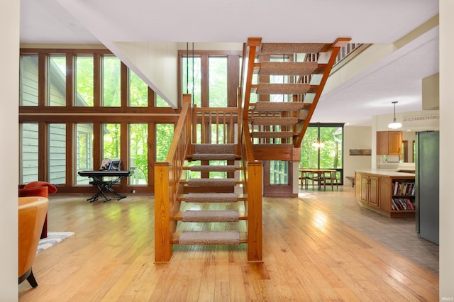 7301 W River Rd, Yorktown, IN 47396 - stairway with hardwood / wood-style floors