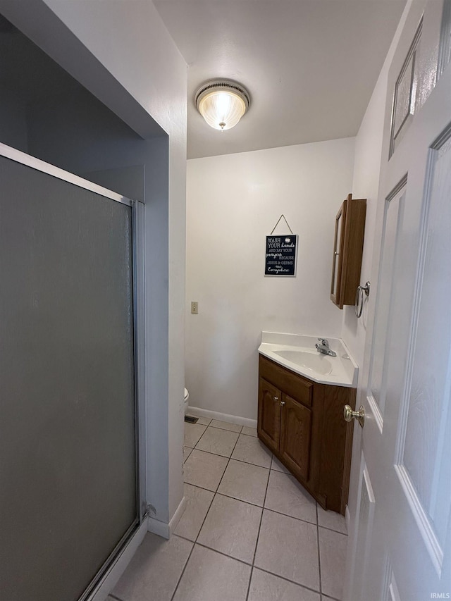 7540 S US-27 Hwy, Portland, IN 47371 - full bath with vanity, toilet, a shower stall, tile patterned flooring, and baseboards